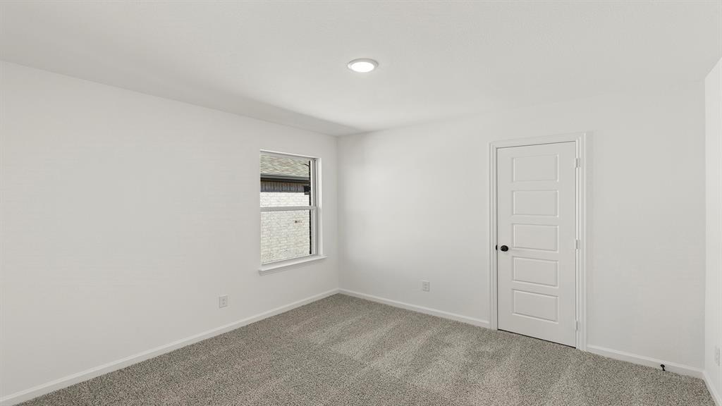 2524 YO Rnch Road Anna, TX 75409 - Photo 23 of 30 an empty room with windows and closet