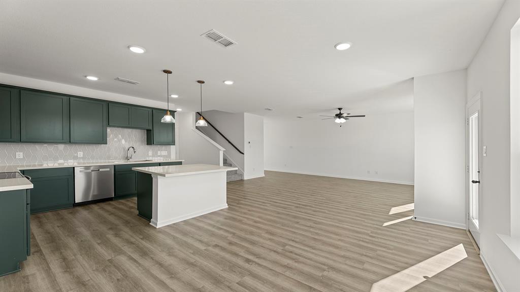 2524 YO Rnch Road Anna, TX 75409 - Photo 8 of 30 a large white kitchen with a sink a window and stainless steel appliances