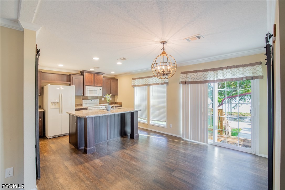 1580 Ridgdill Road Clewiston, FL 33440 - Photo 11 of 30 a view of kitchen with granite countertop refrigerator oven and a sink