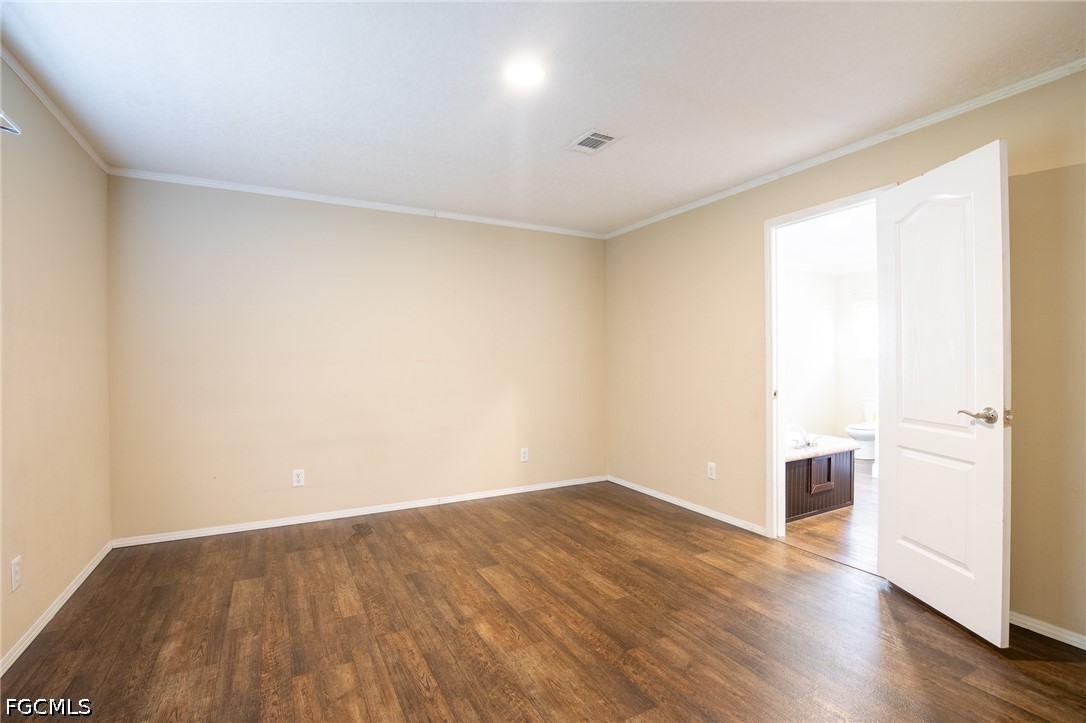 1580 Ridgdill Road Clewiston, FL 33440 - Photo 14 of 30 wooden floor in an empty room