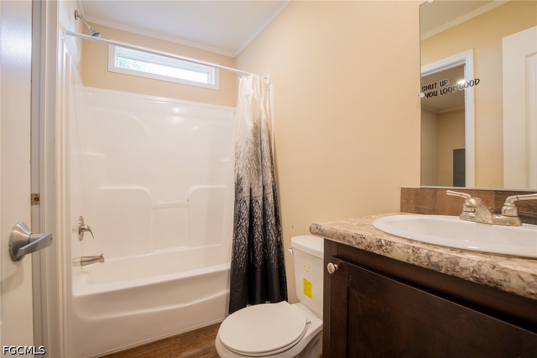 1580 Ridgdill Road Clewiston, FL 33440 - Photo 22 of 30 a bathroom with a granite countertop sink toilet and shower