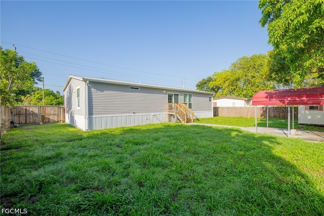 1580 Ridgdill Road Clewiston, FL 33440 - Photo 25 of 30 a view of a backyard with garden