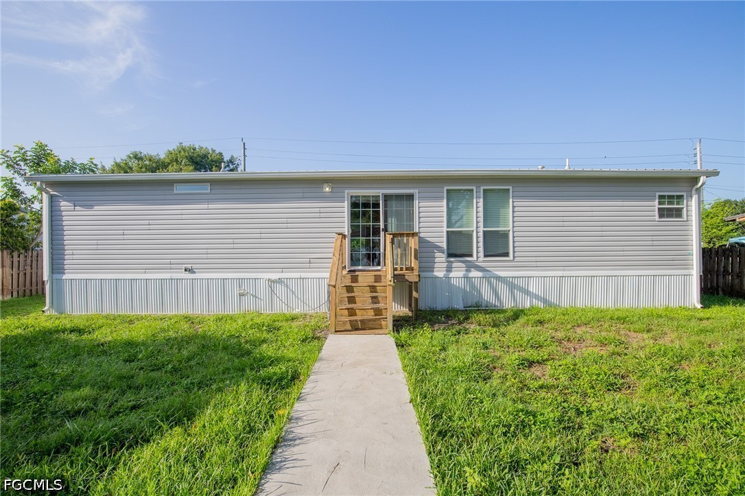 1580 Ridgdill Road Clewiston, FL 33440 - Photo 29 of 30 a front view of a house with yard and green space