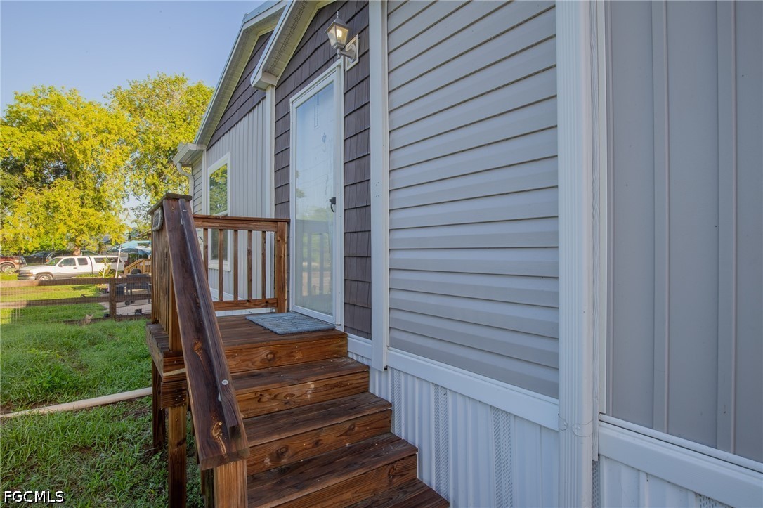 1580 Ridgdill Road Clewiston, FL 33440 - Photo 5 of 30 a view of a porch with wooden floor and stairs