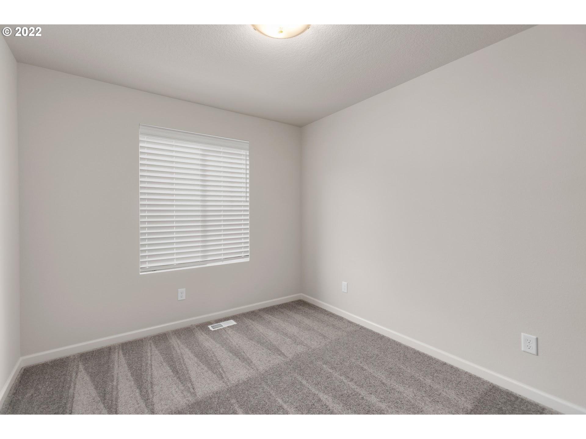 4225 South Cloverhill Way Ridgefield, WA 98642 - Photo 21 of 25 a view of an empty room with a window
