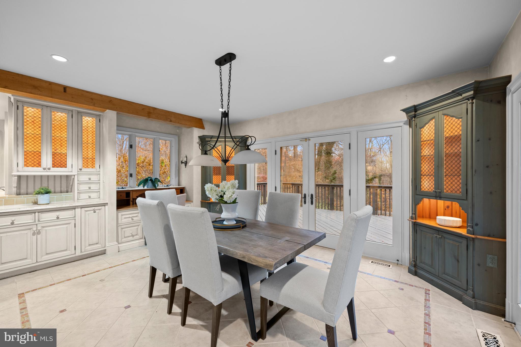 11552 Springridge Road Potomac, MD 20854 - Photo 17 of 65 a view of a dining room with furniture window and outside view