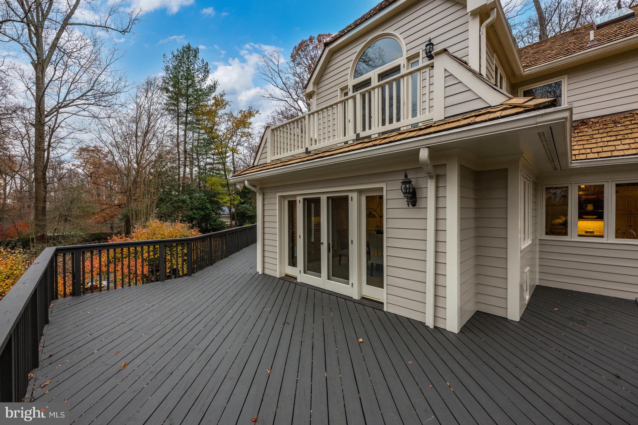 11552 Springridge Road Potomac, MD 20854 - Photo 18 of 65 a view of a house with backyard and deck