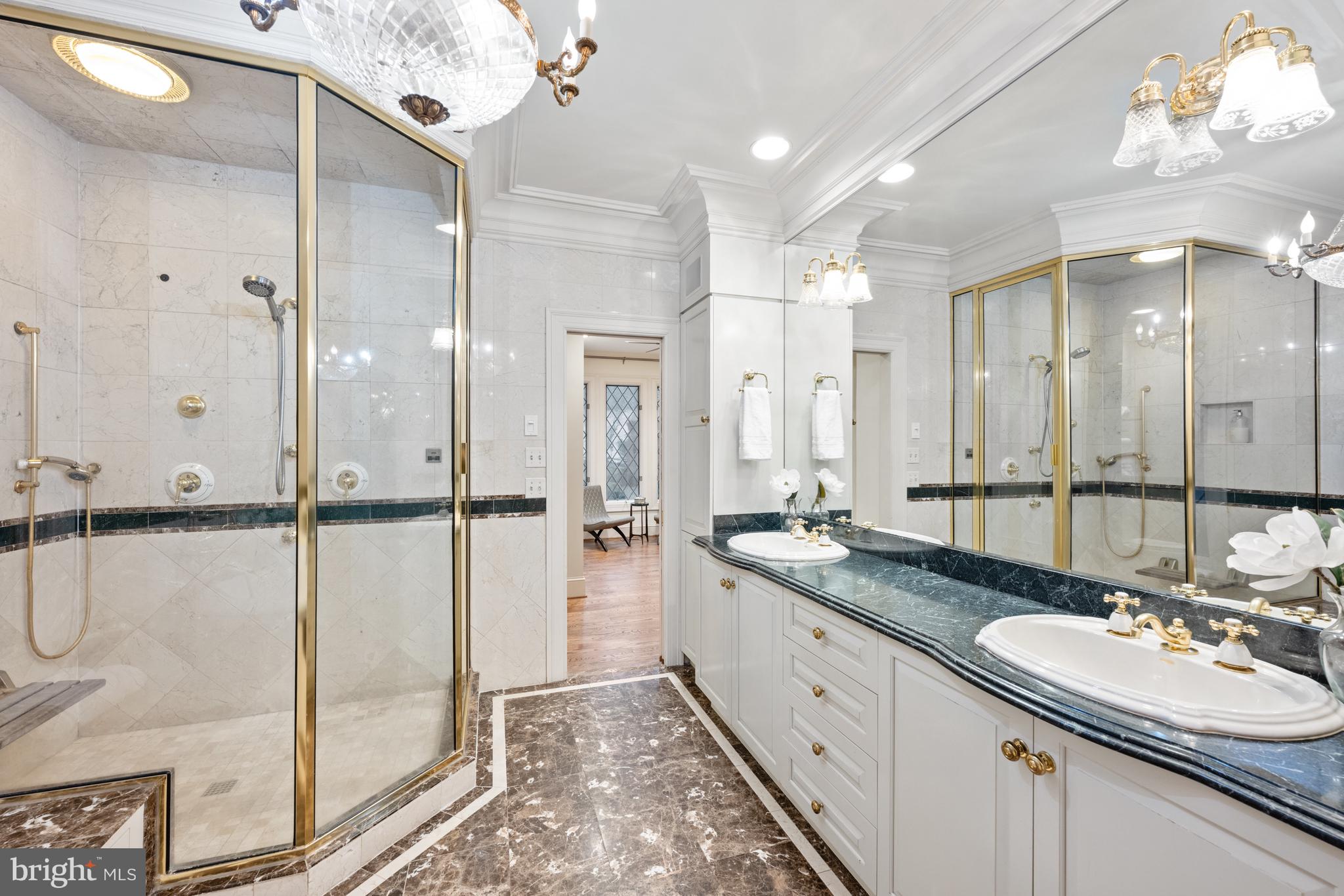 11552 Springridge Road Potomac, MD 20854 - Photo 25 of 65 a bathroom with a double vanity sink mirror and shower