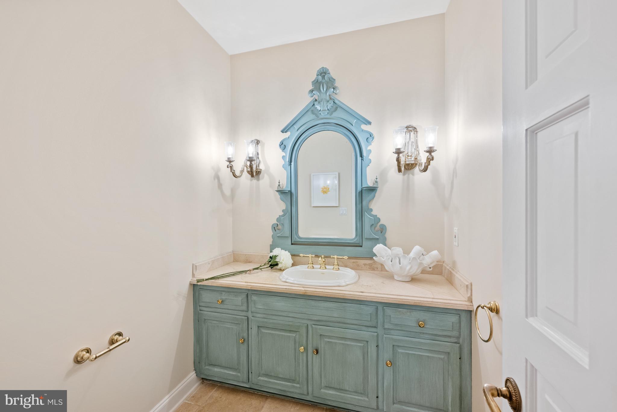 11552 Springridge Road Potomac, MD 20854 - Photo 29 of 65 a bathroom with a sink and a mirror