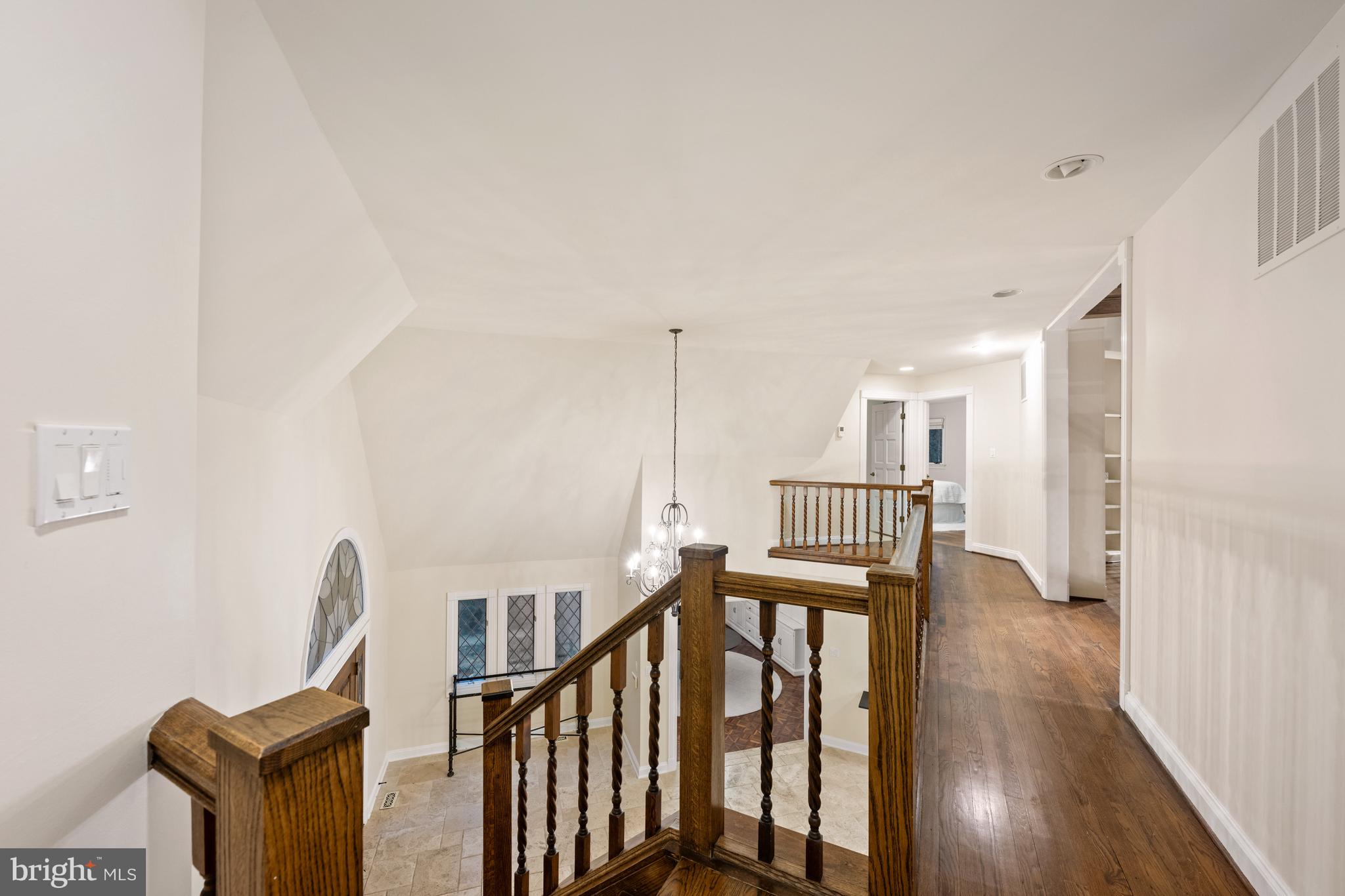 11552 Springridge Road Potomac, MD 20854 - Photo 33 of 65 a view of hallway with wooden floor and stairs