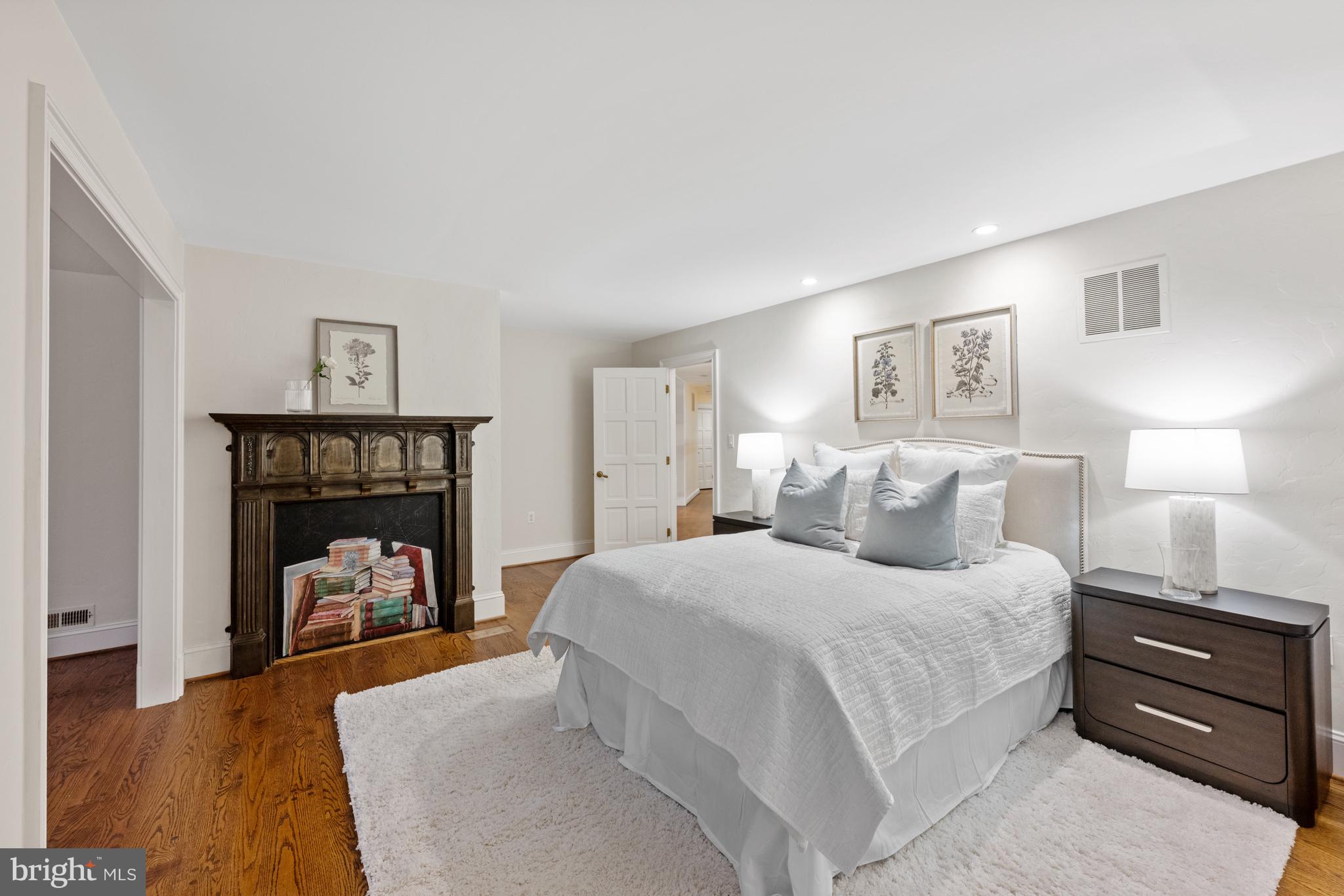 11552 Springridge Road Potomac, MD 20854 - Photo 34 of 65 a bedroom with a bed and a mirror