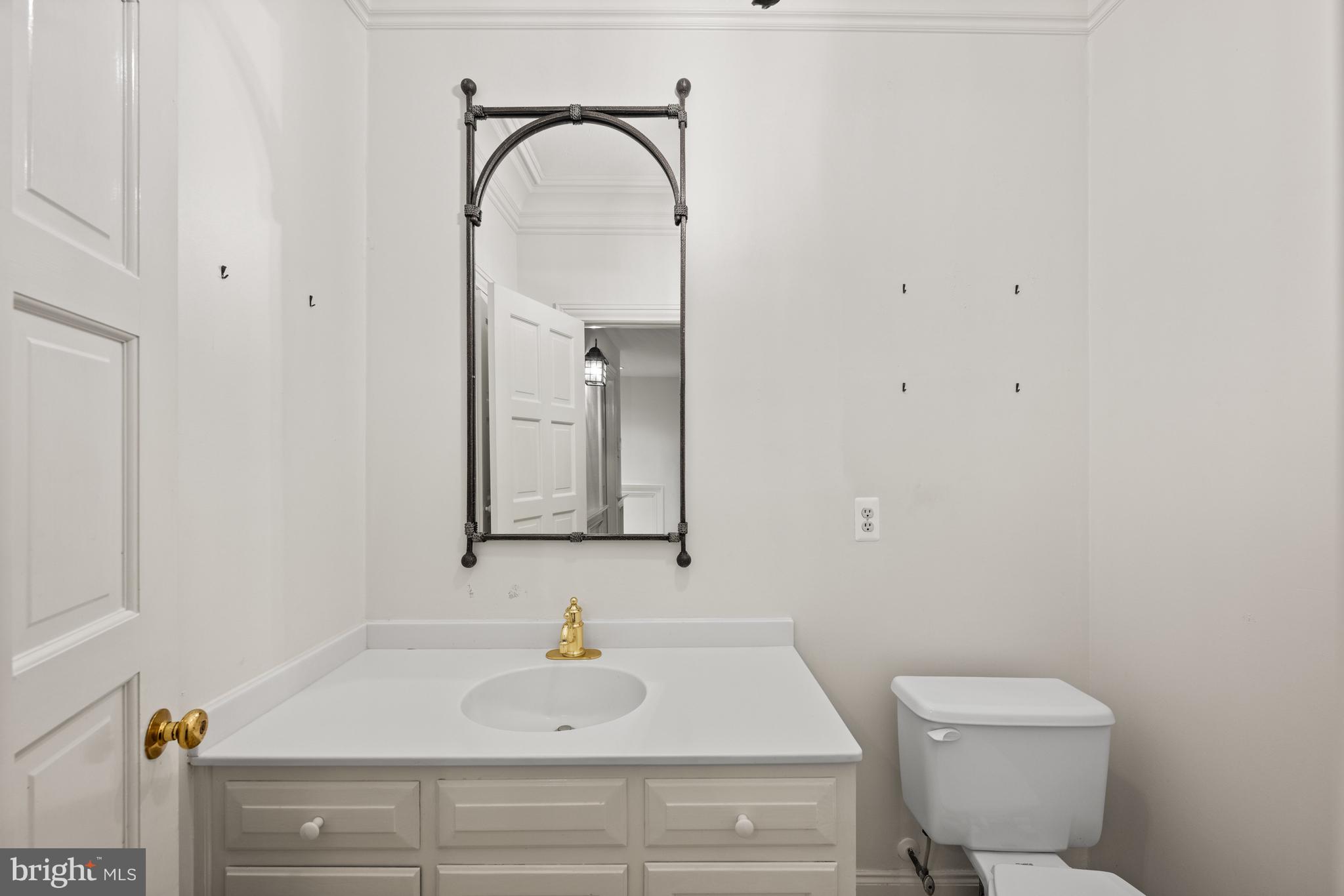 11552 Springridge Road Potomac, MD 20854 - Photo 57 of 65 a bathroom with a sink and a toilet