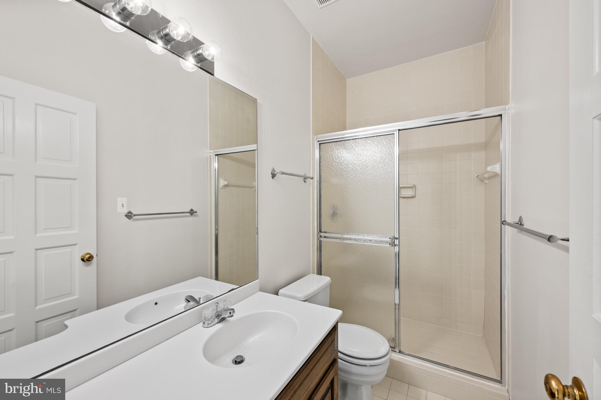 11552 Springridge Road Potomac, MD 20854 - Photo 58 of 65 a bathroom with a sink a toilet and shower