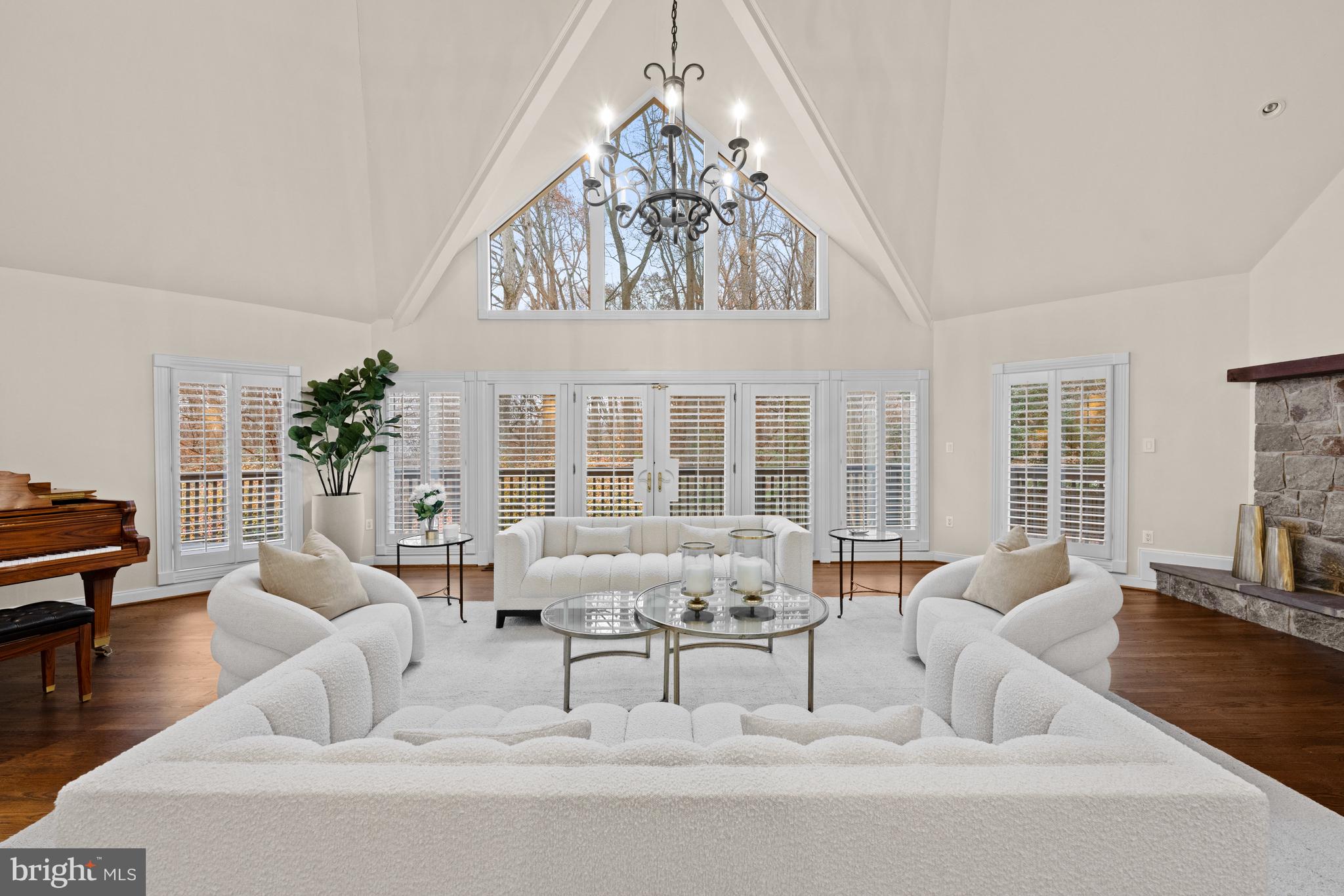 11552 Springridge Road Potomac, MD 20854 - Photo 8 of 65 a living room with furniture and chandelier