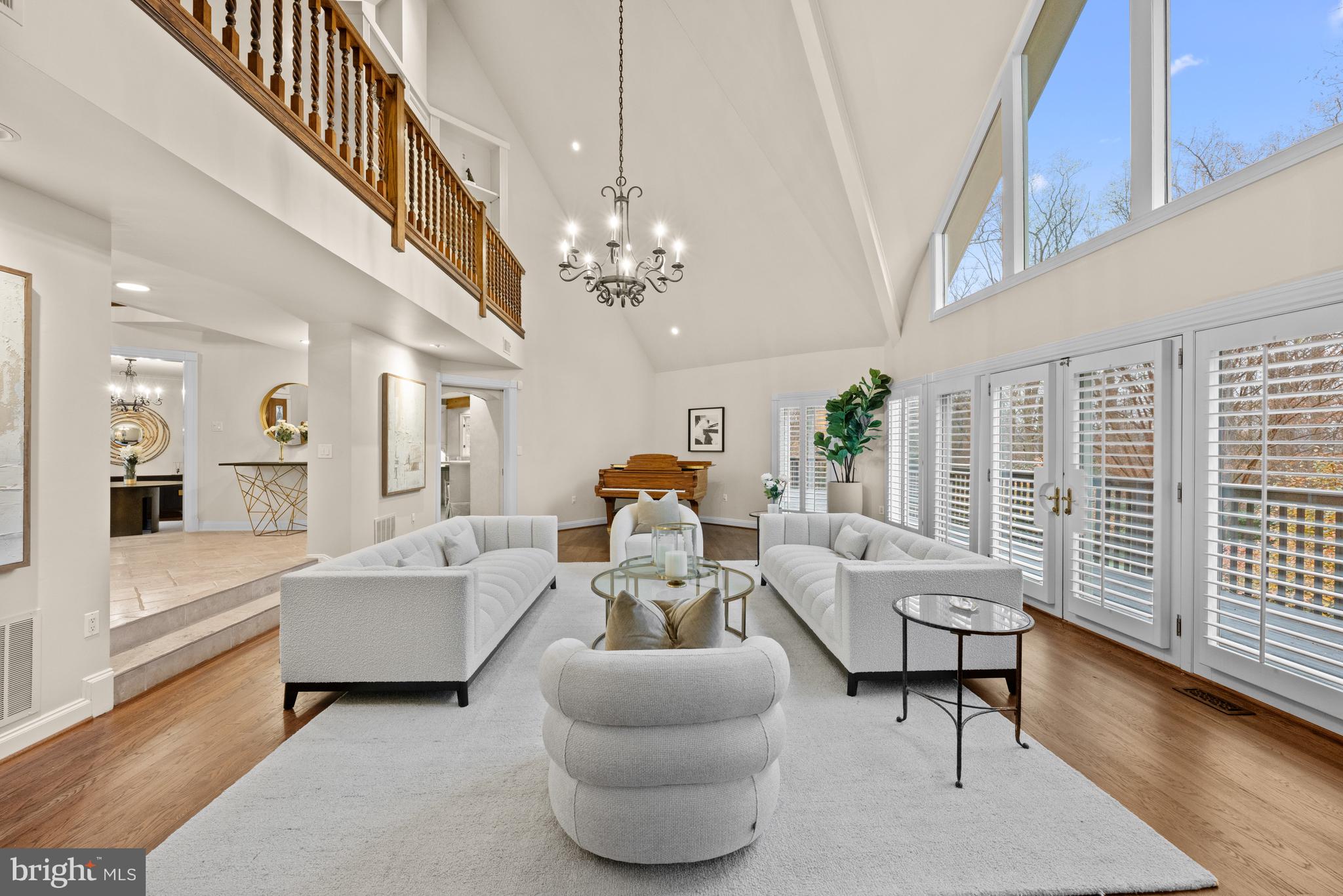 11552 Springridge Road Potomac, MD 20854 - Photo 9 of 65 a living room with furniture a chandelier and a chandelier