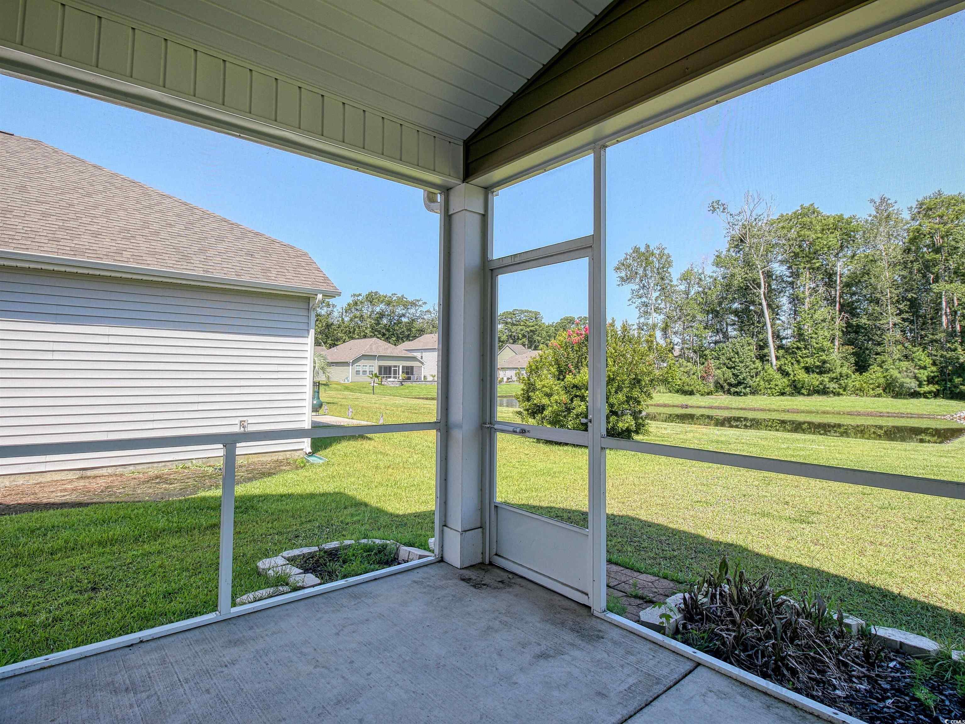 504 Patapsco Street Little River, SC 29566 - Photo 10 of 21 Unfurnished sunroom with lofted ceiling