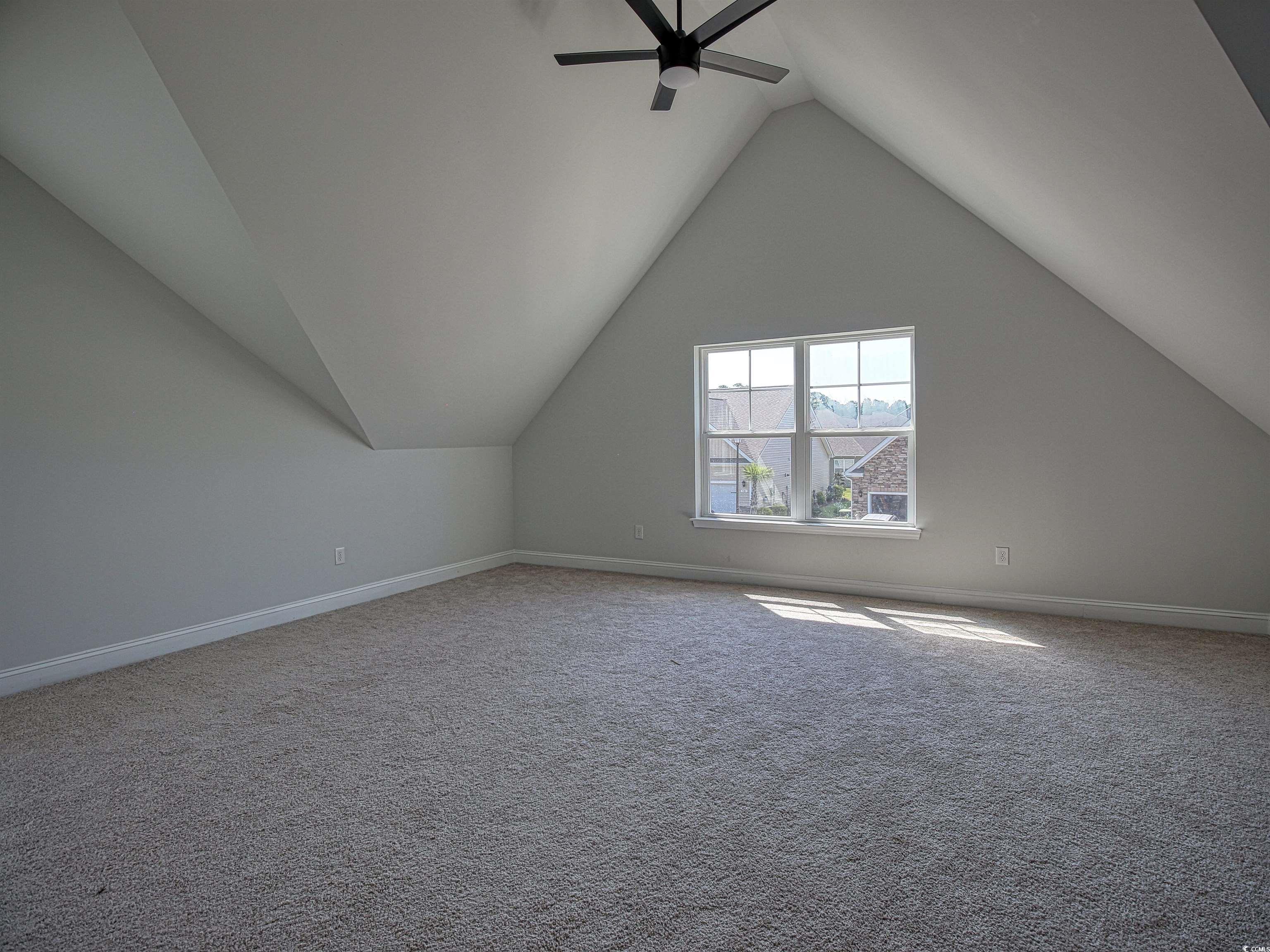 504 Patapsco Street Little River, SC 29566 - Photo 12 of 21 Additional living space with ceiling fan, carpet, and lofted ceiling
