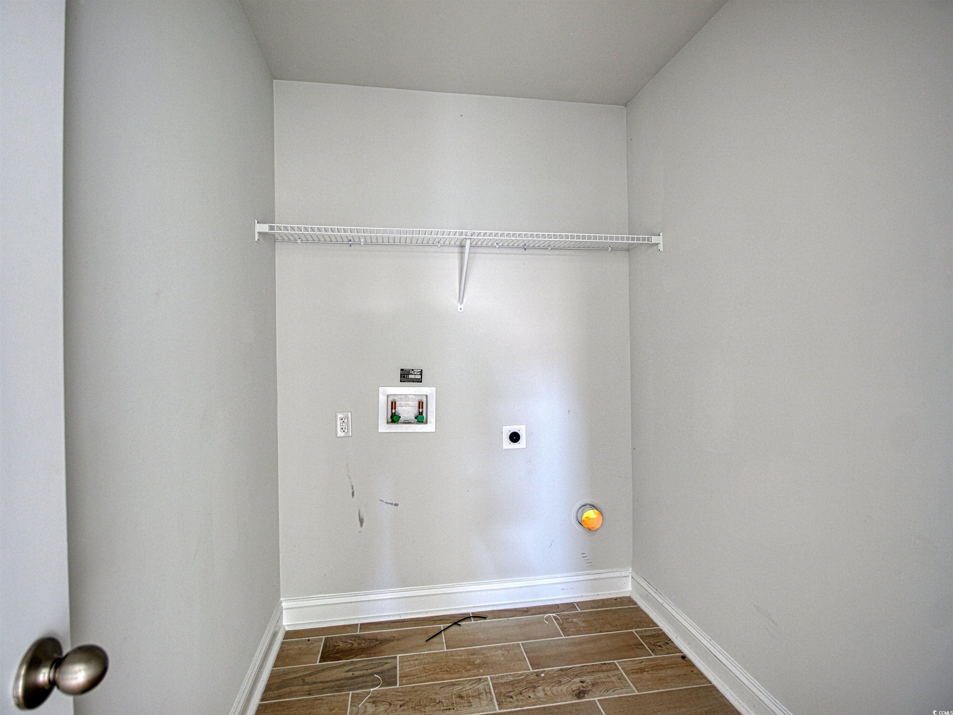504 Patapsco Street Little River, SC 29566 - Photo 14 of 21 Washroom with electric dryer hookup, washer hookup, and wood finish floors