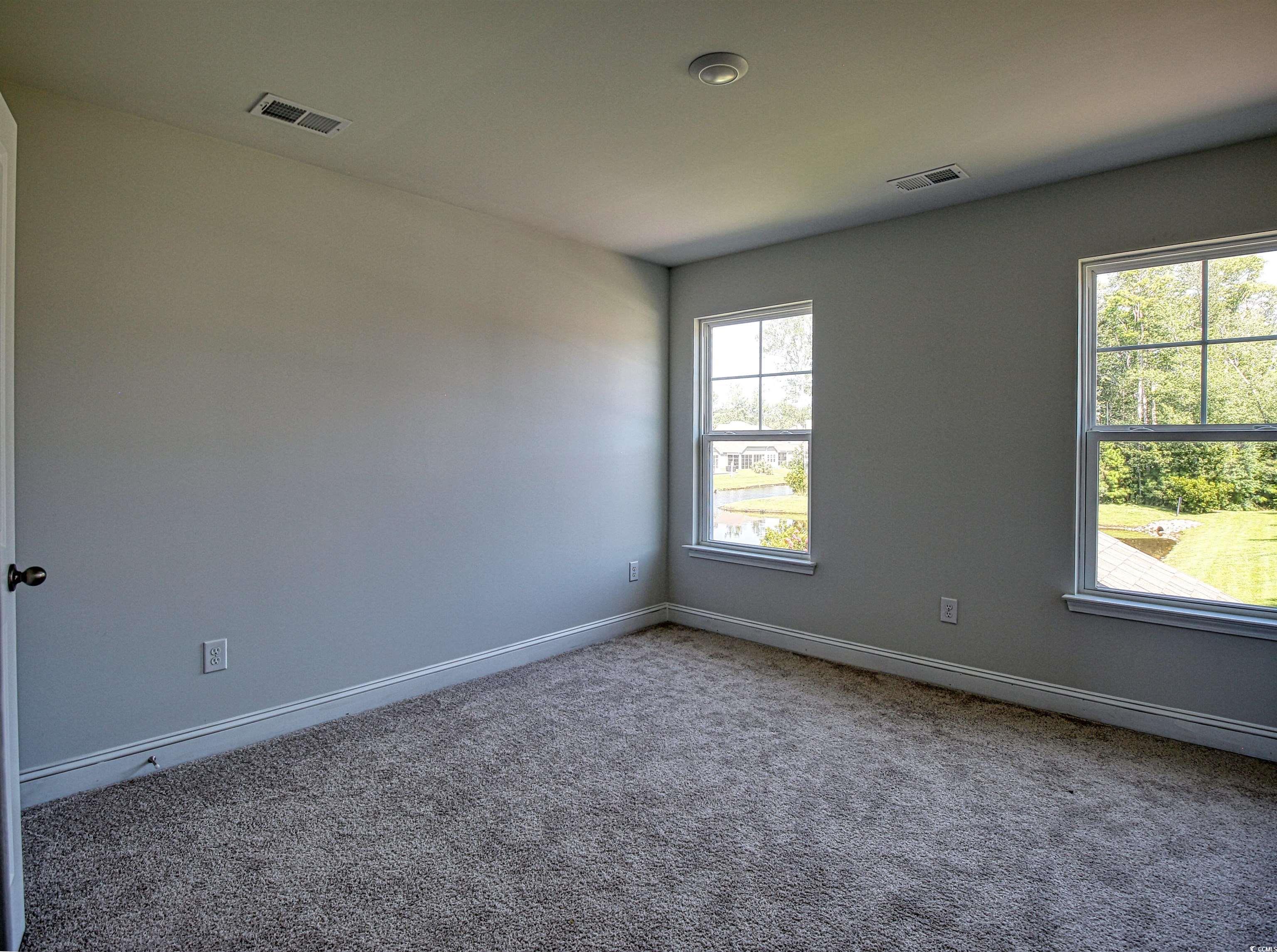504 Patapsco Street Little River, SC 29566 - Photo 17 of 21 Carpeted empty room with baseboards