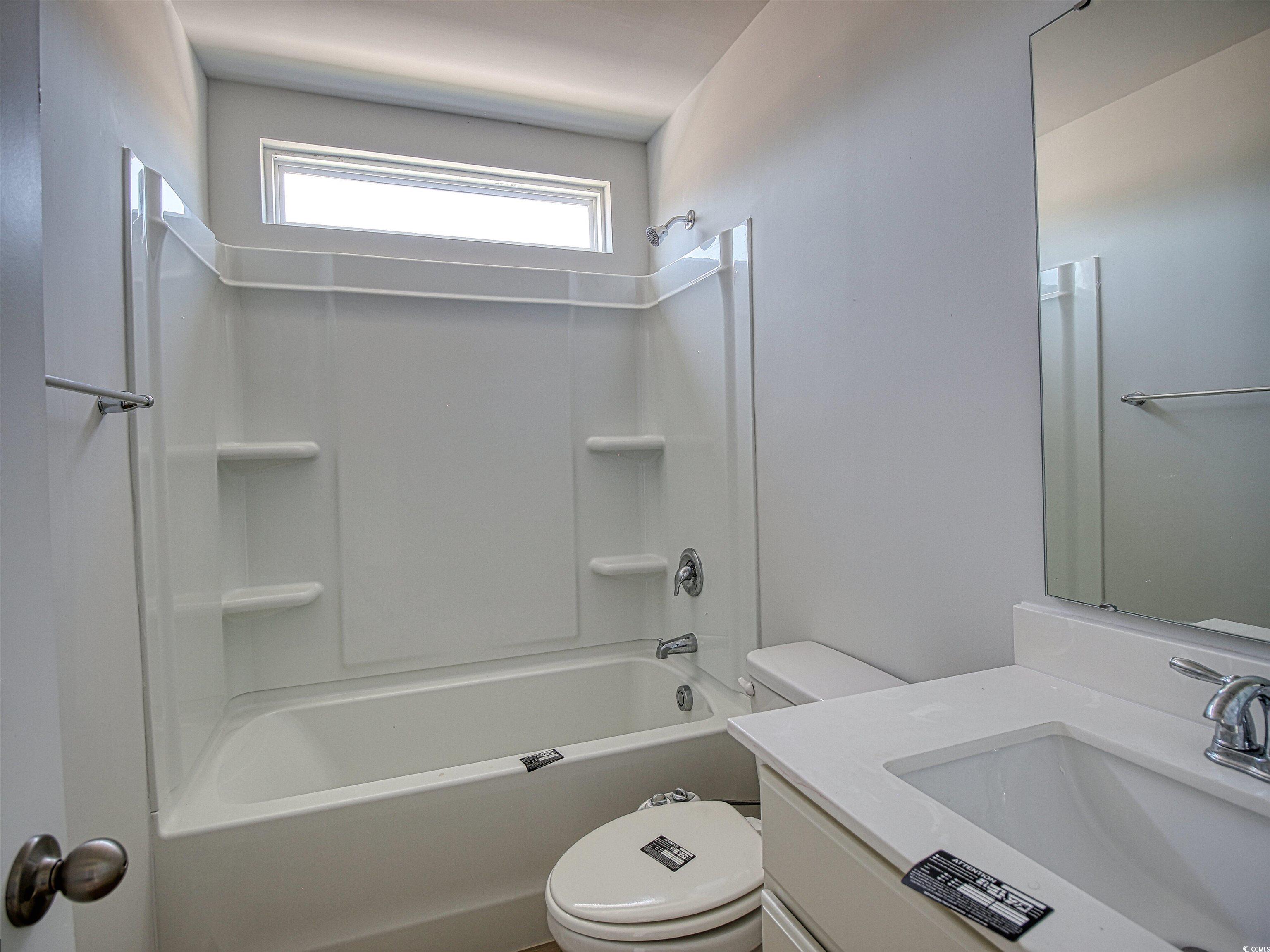 504 Patapsco Street Little River, SC 29566 - Photo 18 of 21 Full bath with vanity and tub / shower combination