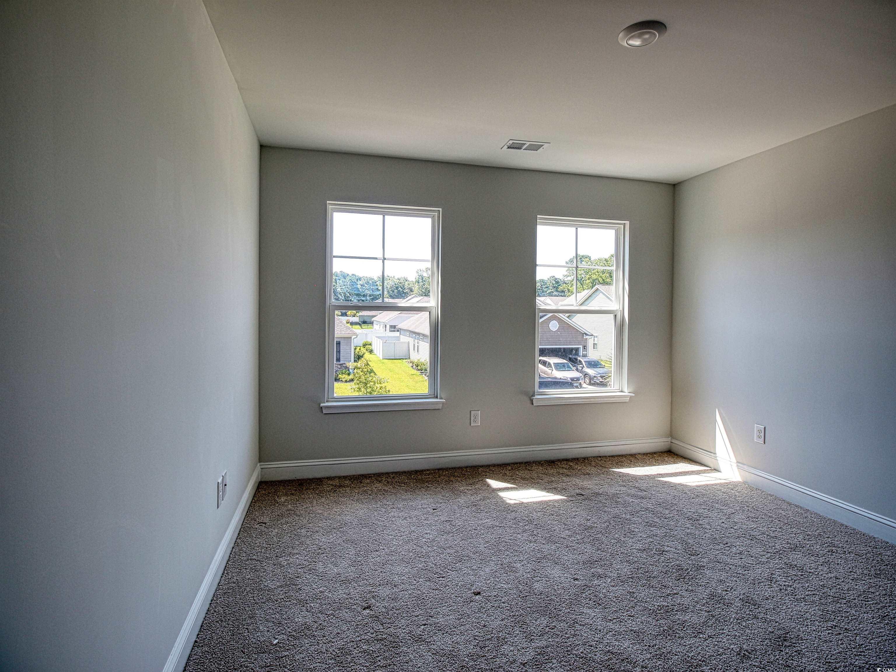 504 Patapsco Street Little River, SC 29566 - Photo 19 of 21 Unfurnished room featuring carpet and baseboards
