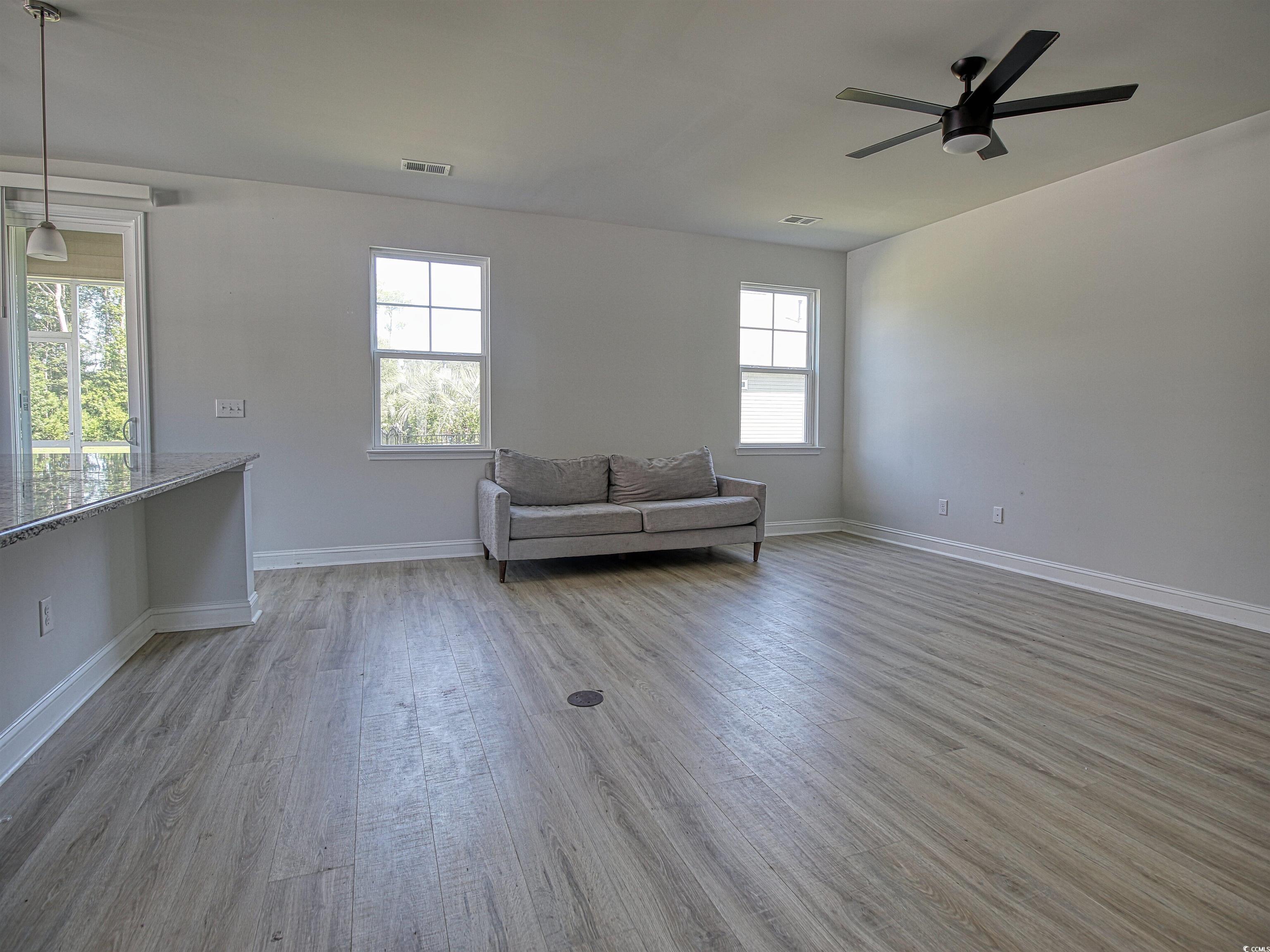 504 Patapsco Street Little River, SC 29566 - Photo 3 of 21 Sitting room featuring wood finished floors and a ceiling fan