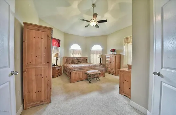 a kitchen with stainless steel appliances granite countertop a sink and a refrigerator