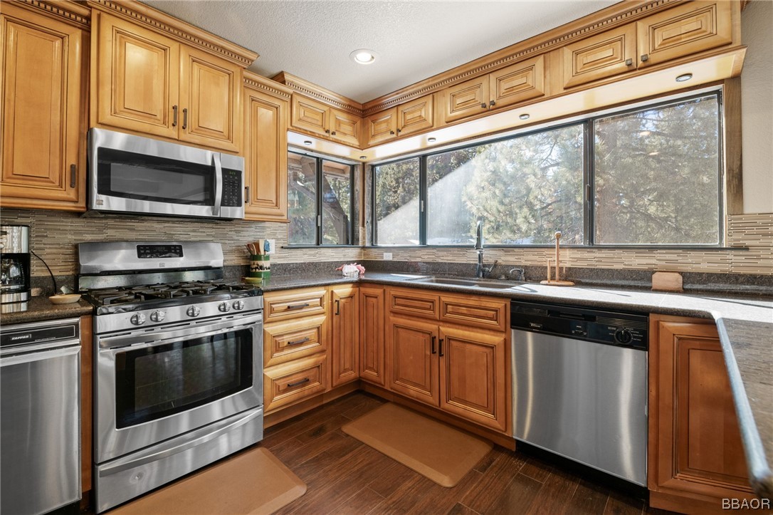 368 Pulaski Road Big Bear Lake, CA 92315 - Photo 13 of 44 a kitchen with stainless steel appliances granite countertop a stove and a microwave