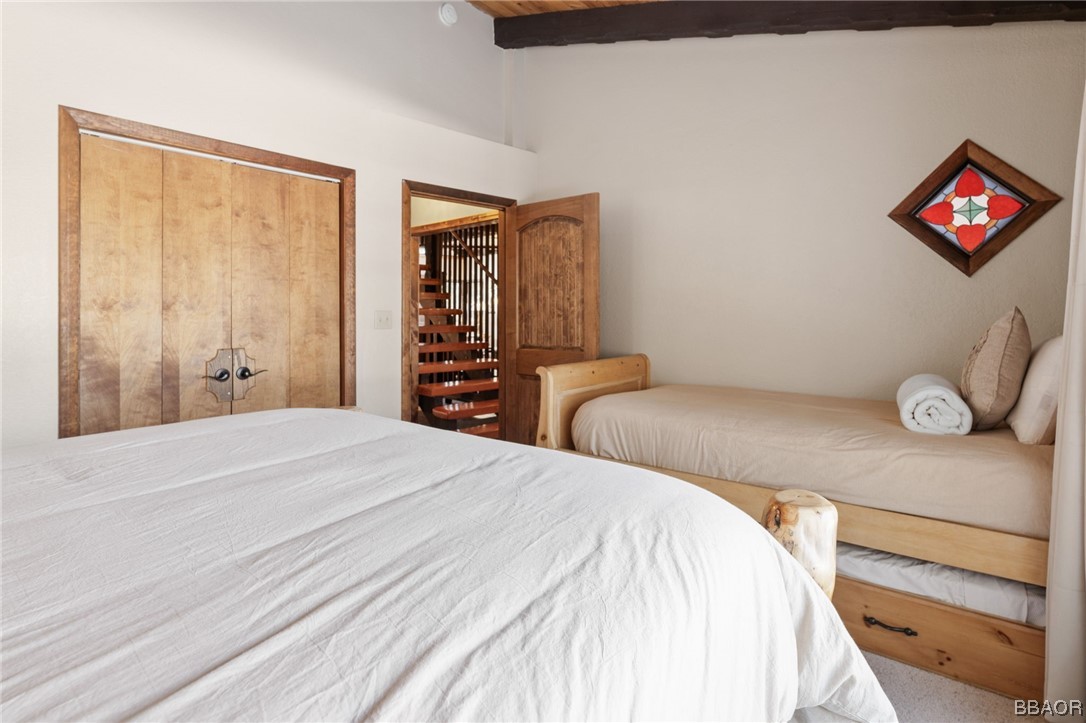 368 Pulaski Road Big Bear Lake, CA 92315 - Photo 24 of 44 a bedroom with a bed and a dresser