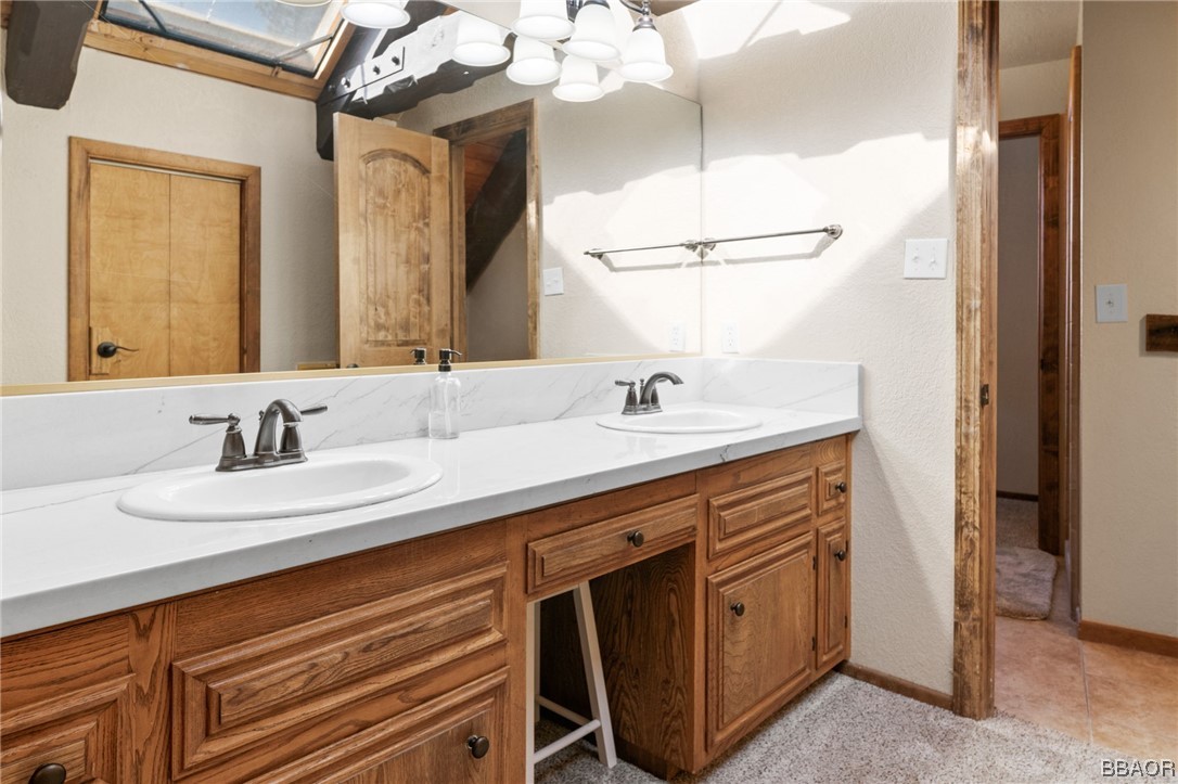 368 Pulaski Road Big Bear Lake, CA 92315 - Photo 29 of 44 a bathroom with a sink double vanity and a mirror