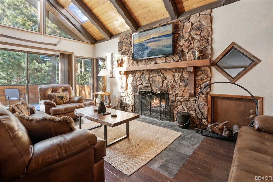 368 Pulaski Road Big Bear Lake, CA 92315 - Photo 5 of 44 a living room with furniture a fireplace and a large window