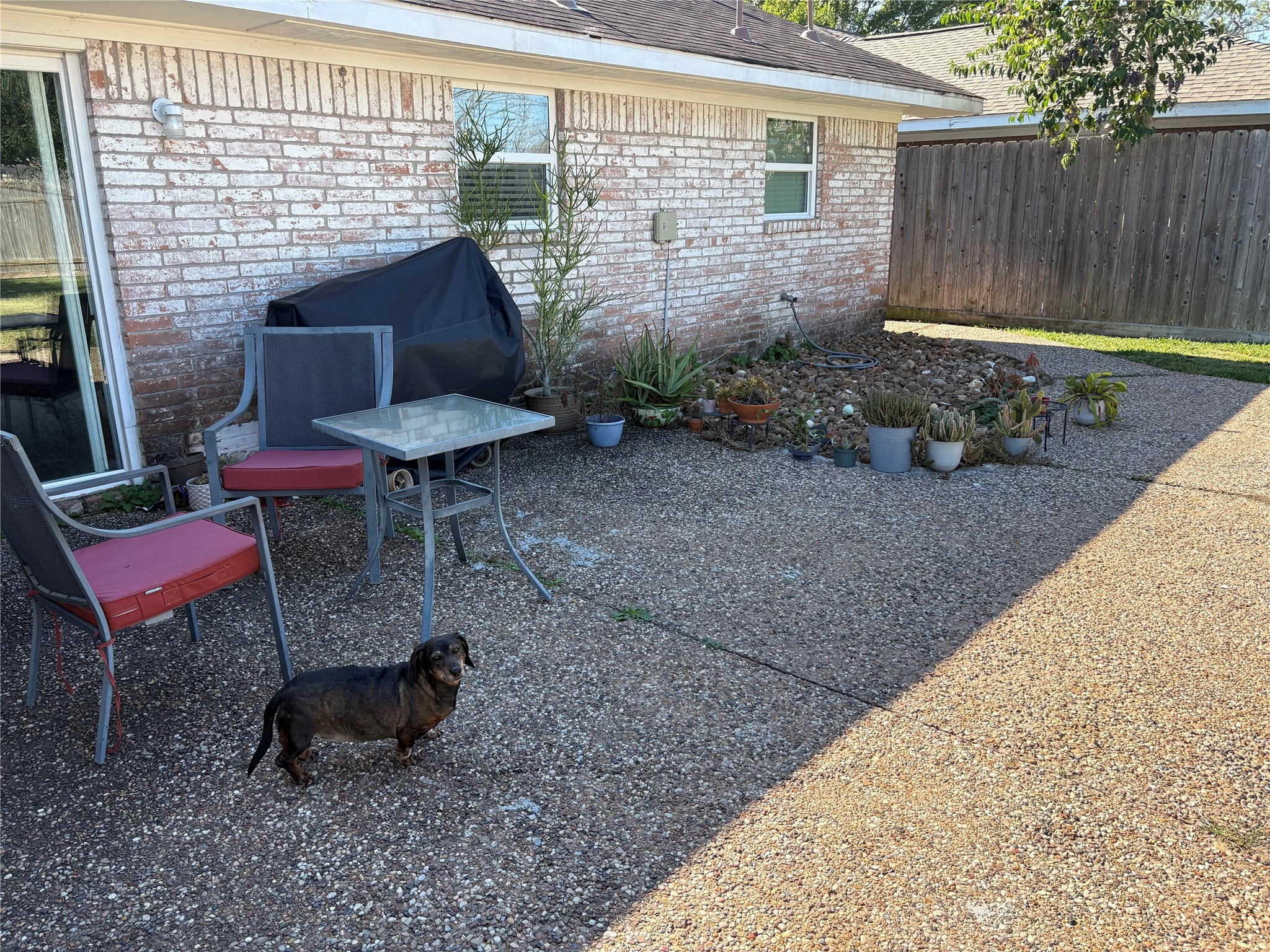 9530 Emnora Lane Houston, TX 77080 - Photo 11 of 16 a backyard of a house with outdoor seating