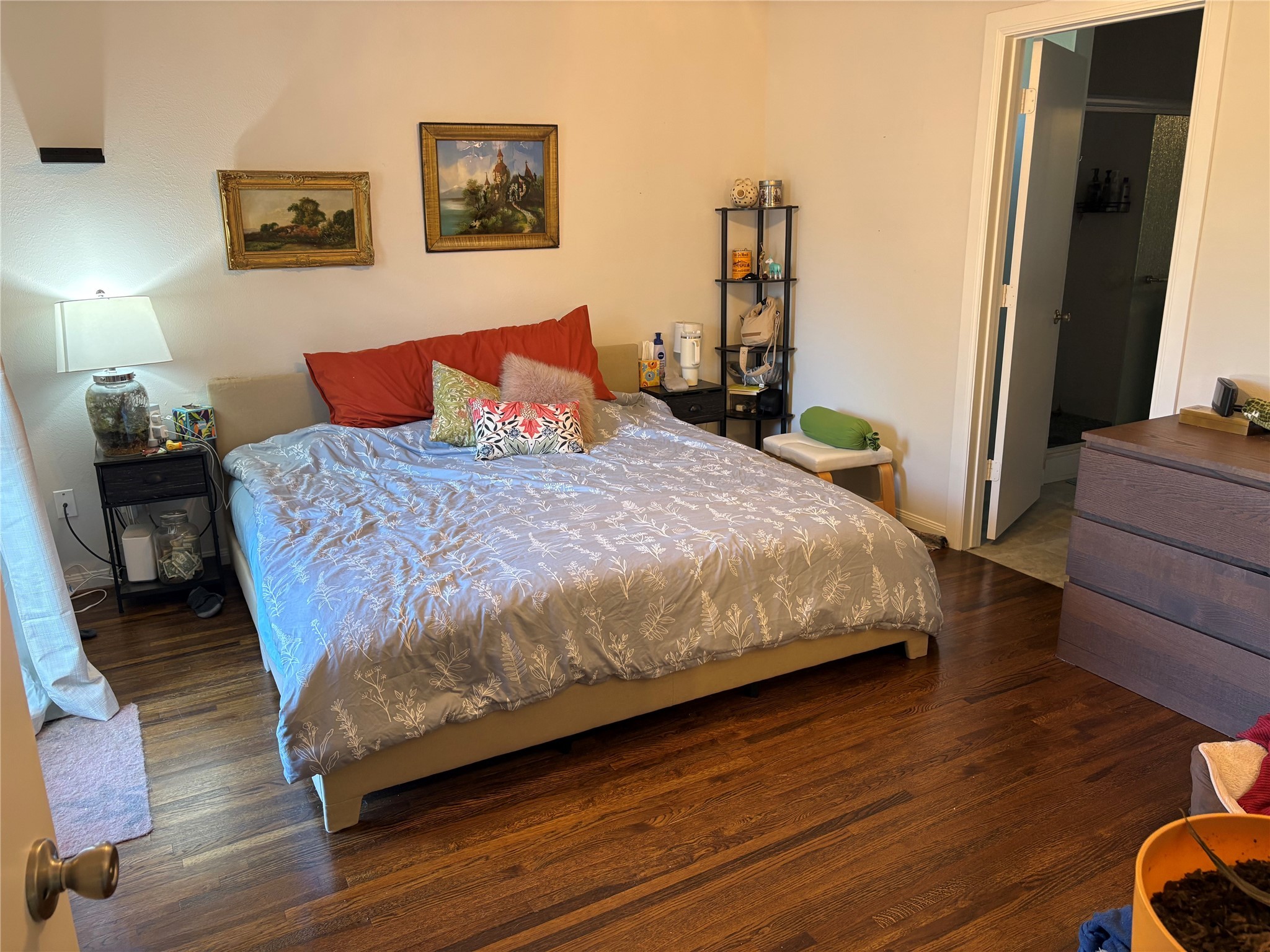 9530 Emnora Lane Houston, TX 77080 - Photo 3 of 16 a bedroom with a bed and wooden floor