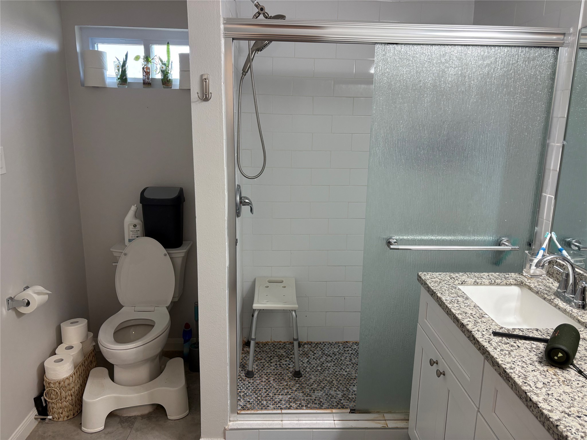 9530 Emnora Lane Houston, TX 77080 - Photo 5 of 16 a bathroom with a granite countertop sink toilet and shower