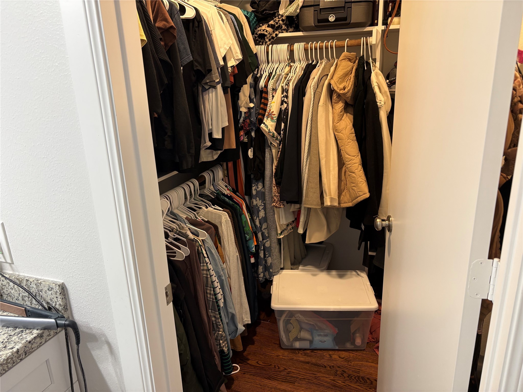 9530 Emnora Lane Houston, TX 77080 - Photo 6 of 16 a view of walk in closet with clothes and shoes