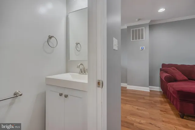 a bathroom with a sink and a mirror