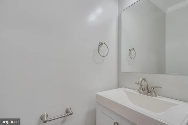a bathroom with a sink and mirror