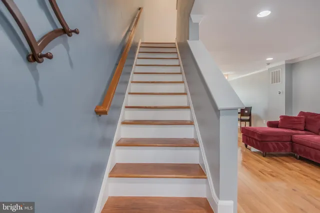 a view of entryway and hall with wooden floor