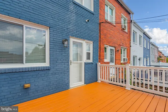 a view of a balcony with a barbeque