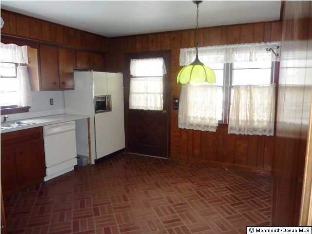 315 Georgia Road Freehold, NJ 07728 - Photo 3 of 3 a kitchen with a window a sink appliances and cabinets