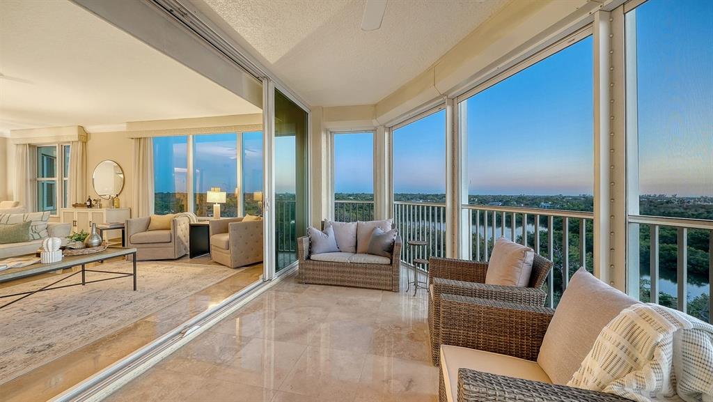 385 North Point Road, Unit 701 Osprey, FL 34229 - Photo 28 of 97 a living room with furniture and a large window