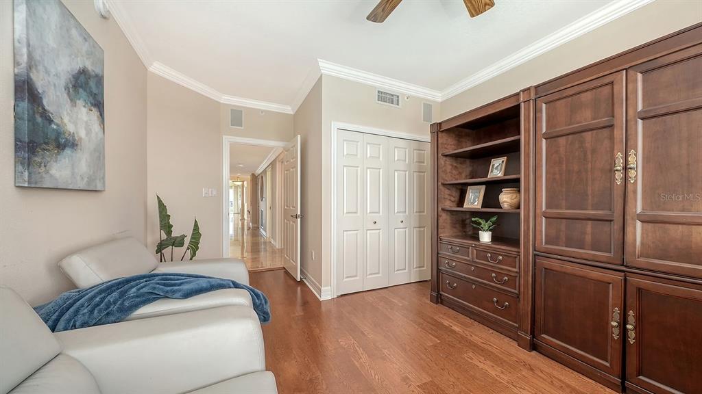 385 North Point Road, Unit 701 Osprey, FL 34229 - Photo 57 of 97 a bedroom with a bed and a cabinets