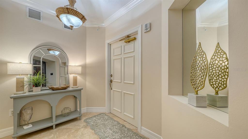 385 North Point Road, Unit 701 Osprey, FL 34229 - Photo 6 of 97 a view of hall way with mirror and furniture