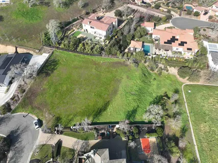 an aerial view of a houses with outdoor space