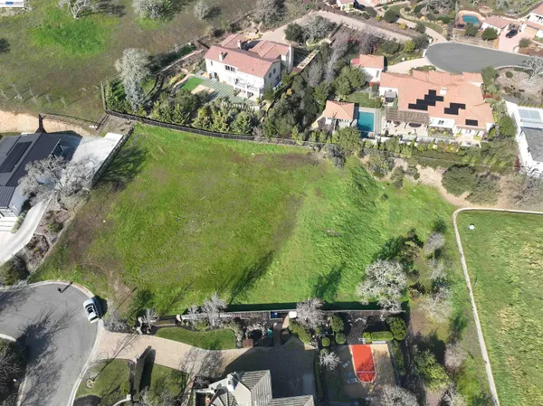 an aerial view of a houses with outdoor space