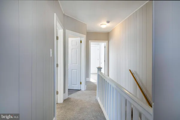 a view of a hallway with closet