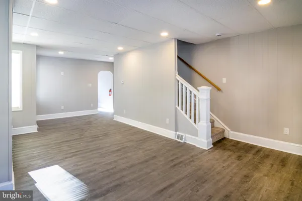 a view of an entryway with wooden floor