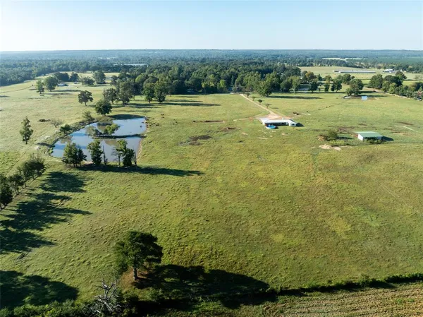 an aerial view of a houses with a lake view