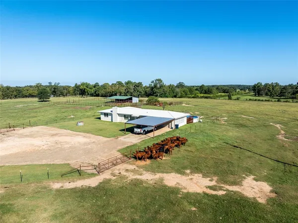 a view of a lake with a yard