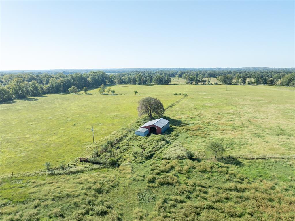 2661 Holly Creek Road Broken Bow, OK 74728 - Photo 21 of 33 a view of a lake with a big yard